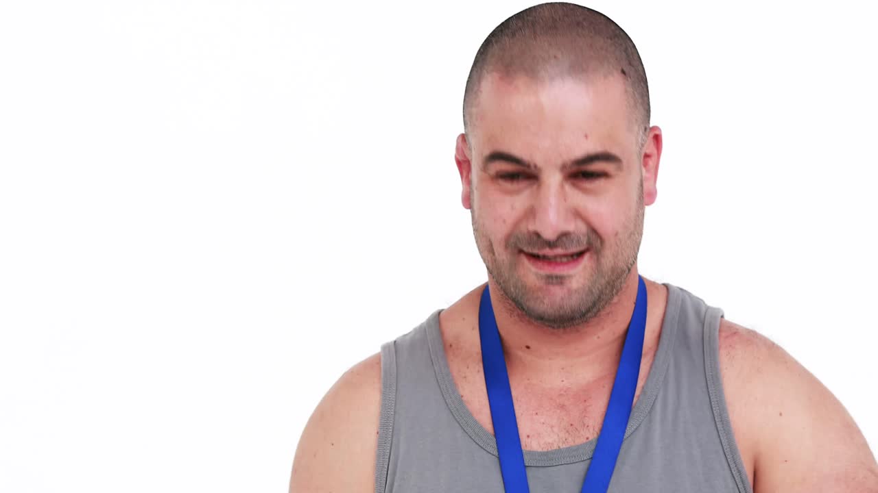 Discus thrower holding medal