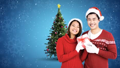 Weihnachtswinterpaar-Mit-Weihnachtsbaum-Und-Geschenk