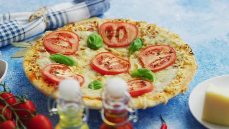 delicious italian pizza served on blue stone table  shot from side