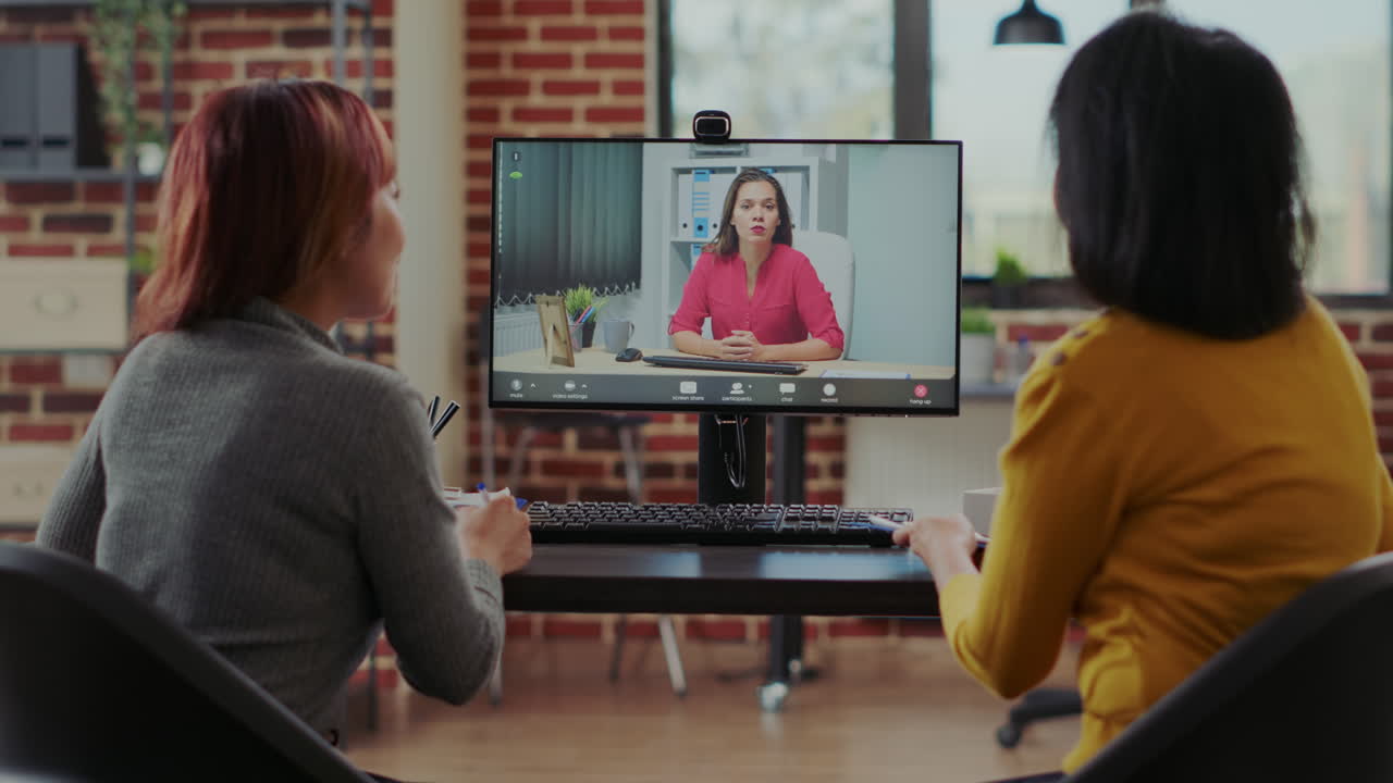 Women meeting with applicant on video call at online job interview