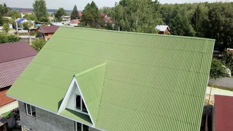 green metal roof on house in rural area