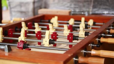 panning across a vacant foosball table