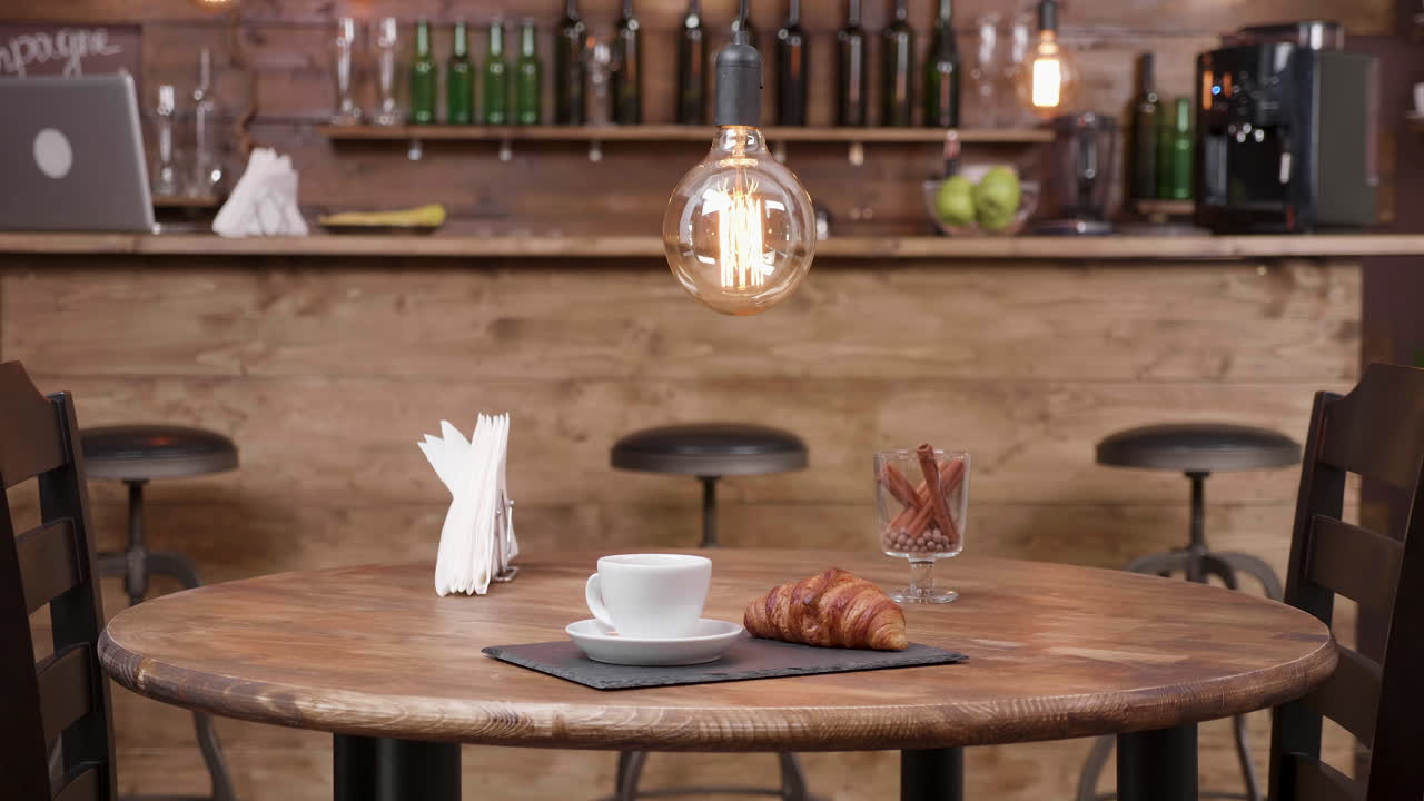 Cafe scene with coffee and croissant