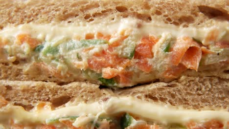 close-up of a sandwich with carrot salad filling