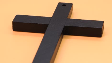 christian cross made of black wood, macro shot