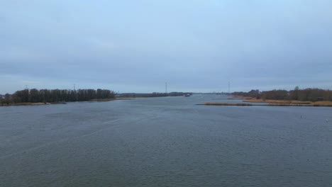 Aerial-Flying-Over-Beneden-Merwede-On-Grey-Overcast-Day