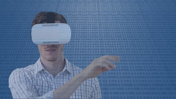 Animation of businessman wearing vr headset over binary coding
