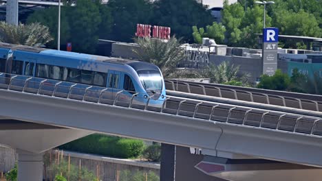 a close-up of a dubai metro train as it heads to its next stop along sheikh zayed road in dubai, uae
