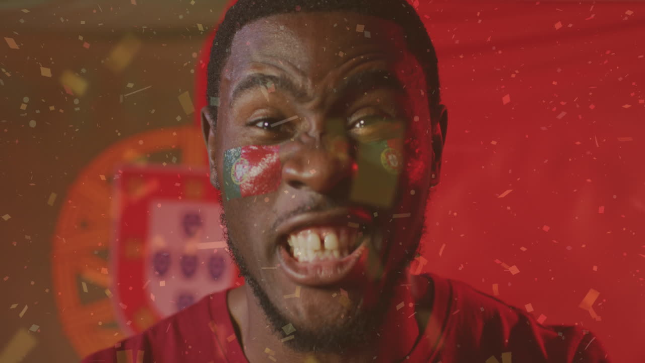 animación de confeti cayendo sobre un futbolista afroamericano celebrando sobre la bandera de portugal