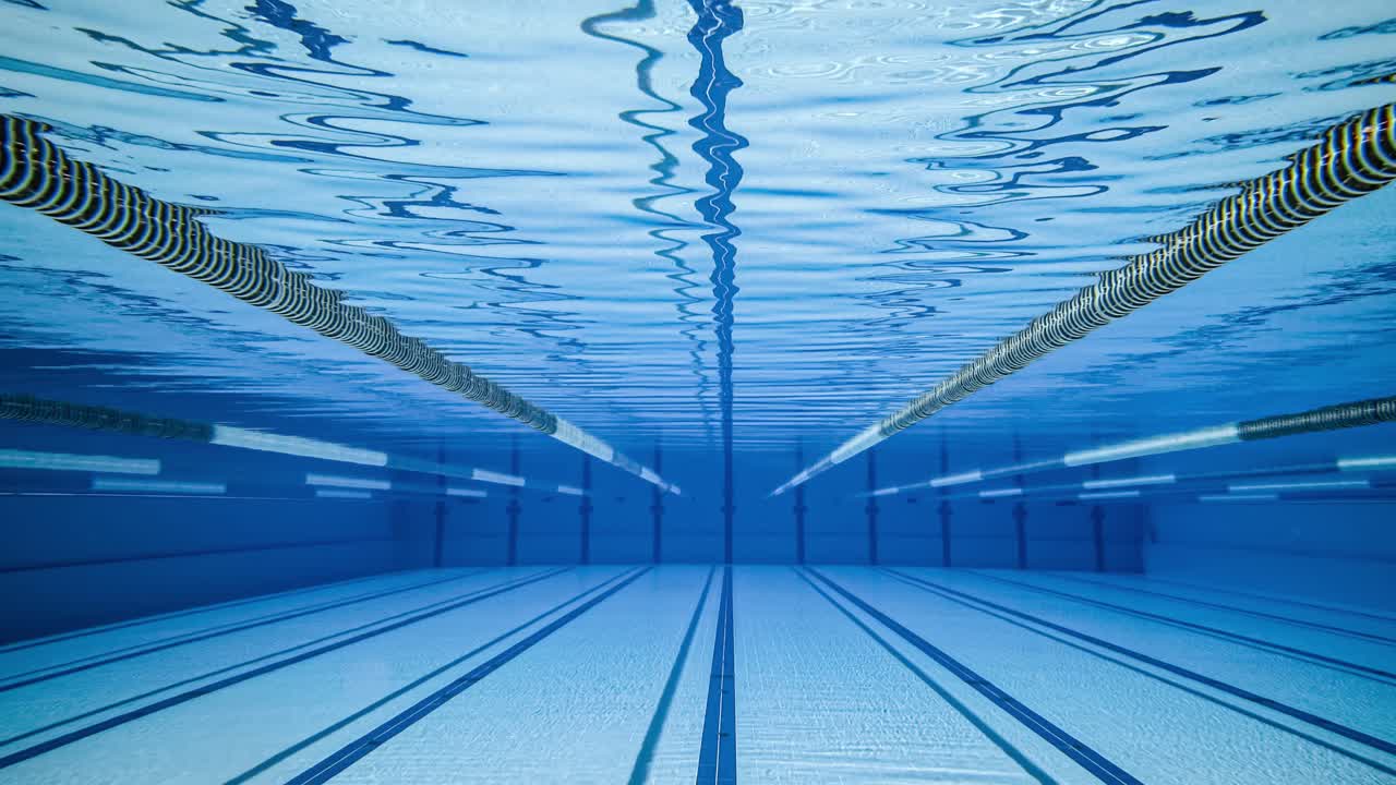 Olympic Swimming pool under water background.
