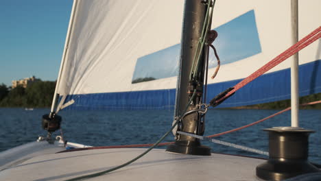 view from the bow of a small sailboat on a minneapolis lake