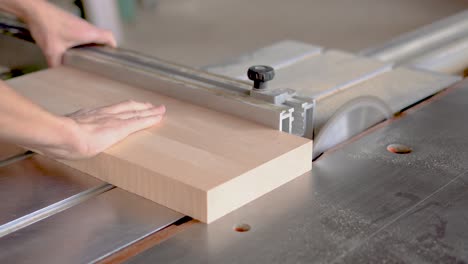 woodworking: measuring and cutting wood on a table saw
