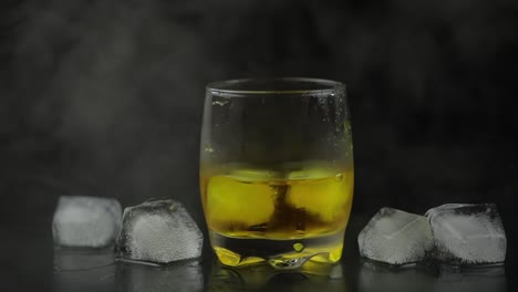 glass of whiskey with ice