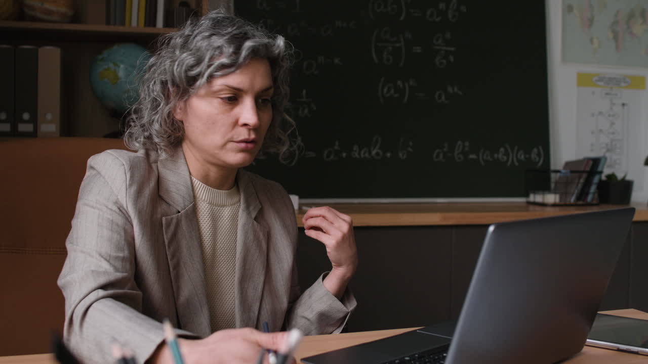 Teacher conducting an online math class