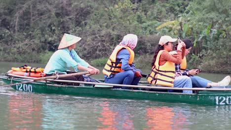 tourists capturing moments on a scenic boat ride