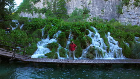 Tourist-Exploring-Scenic-Natures-Of-Plitvice-Lakes-National-Park-In-Croatia