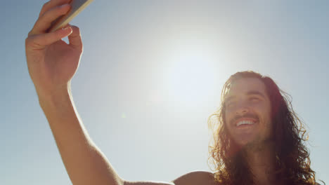 man taking selfie with mobile phone 4k