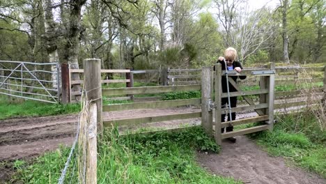 walker opens gate, closes it crosses track opens and closes second gate