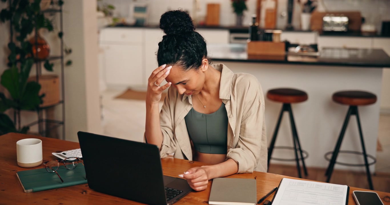Stressed Woman Working on Laptop at Home Office