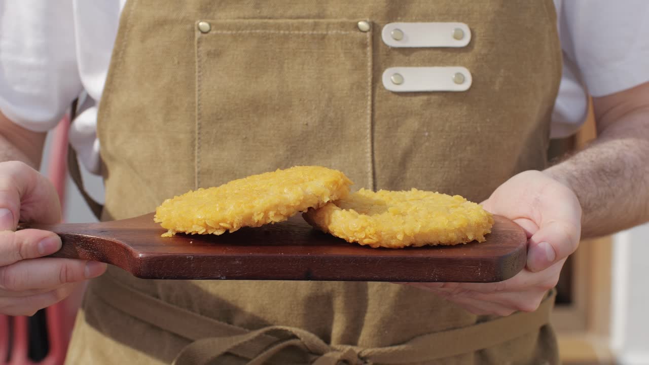 Delicious fresh crispy chicken nuggets on a dark concrete background. Unhealthy food, fast food. High quality 4k footage