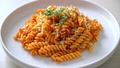 spiral or spirali pasta with tomato sauce and cheese - italian food style