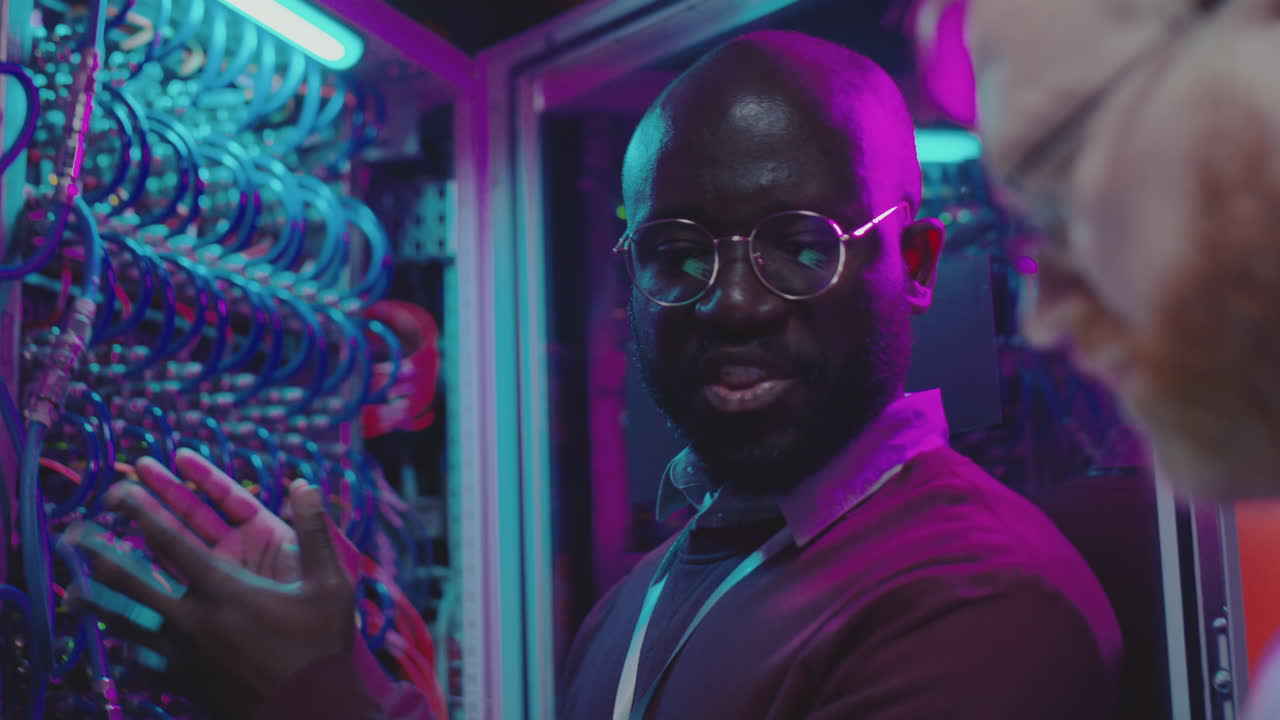 IT Professionals Working in a Server Room