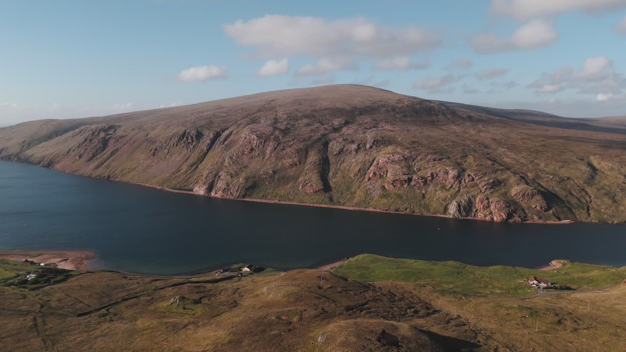 Aerial shot of Ronas hill in Shetland at sunset looking down the sea voe in North Scotland