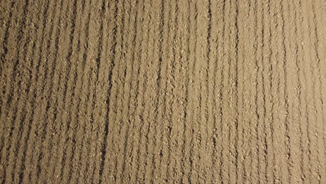 plowed ground soil for agriculture cultivation aerial view