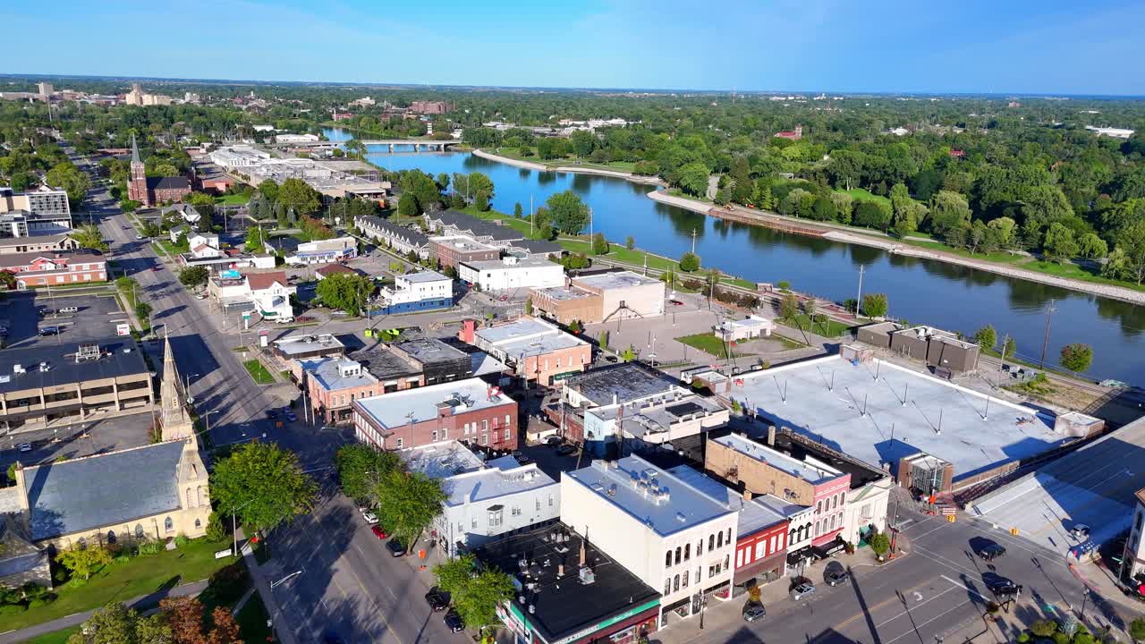 Downtown Saginaw cityscape overlooking Saginaw River and bridge on a sunny day