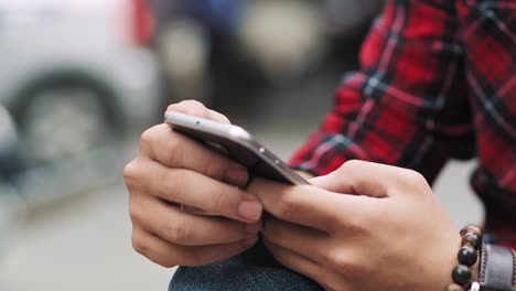 handheld video shows of young vietnamese woman using smart phone