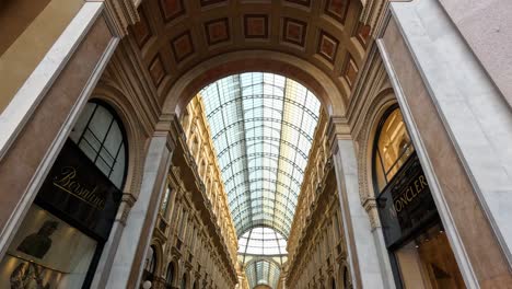 people walking through historic shopping arcade