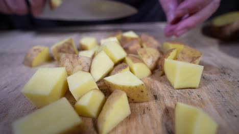 pushing potatoes with a knife in slow motion