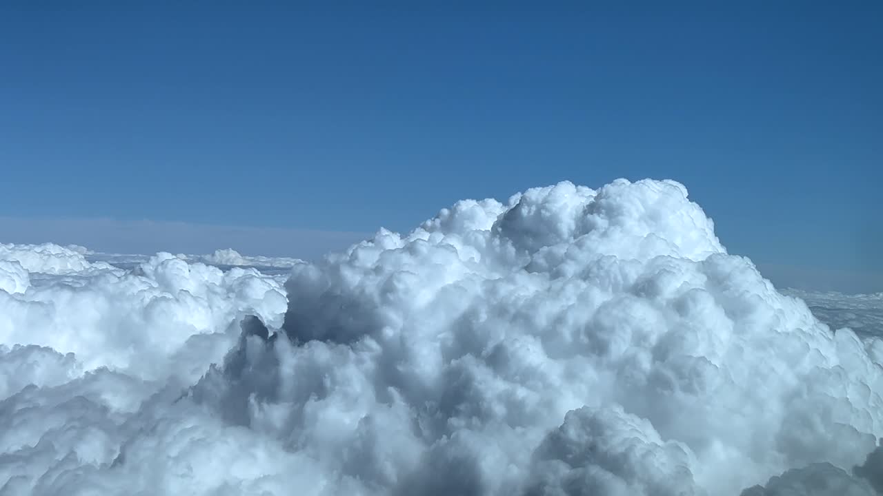 POV flying near a massive cumulonimbus stormy clouds