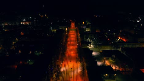 aerial view backwards over the quiet streets of kuopio, winter evening in finland