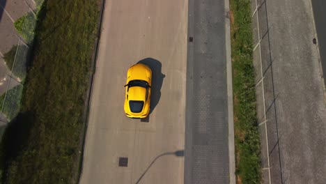 toyota supra driving on a industrial terrain