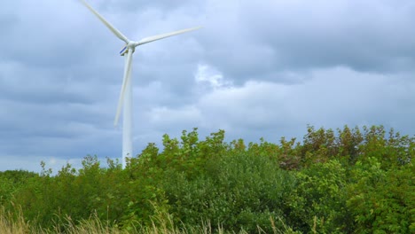 wind turbine slow lateral approach on windy and cloudy day