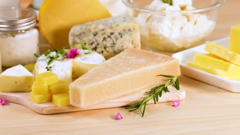 various cheeses and dairy items on a table