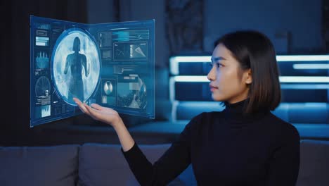 Woman interacting with futuristic holographic medical display