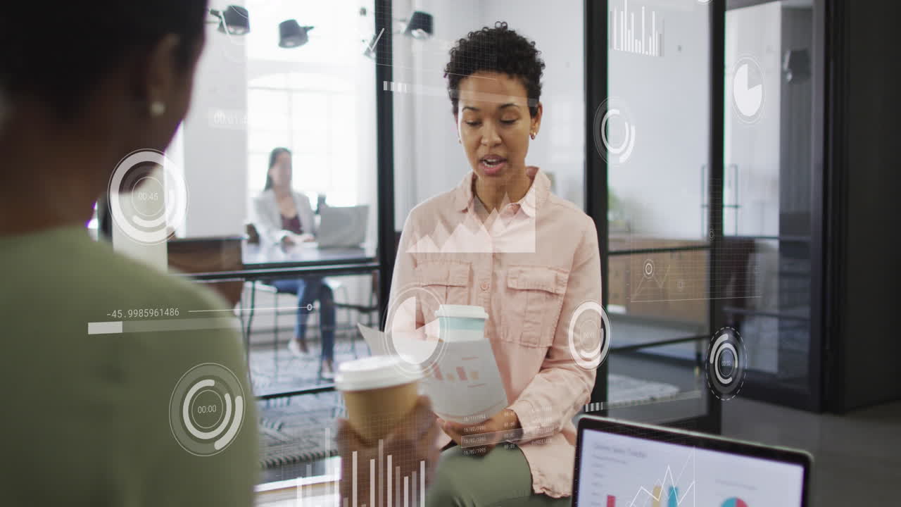 Animation of data processing over diverse business people talking in office