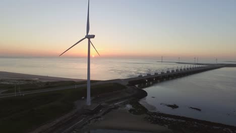 aerial: the oosterschelde storm surge barrier and windturbines in the netherlands