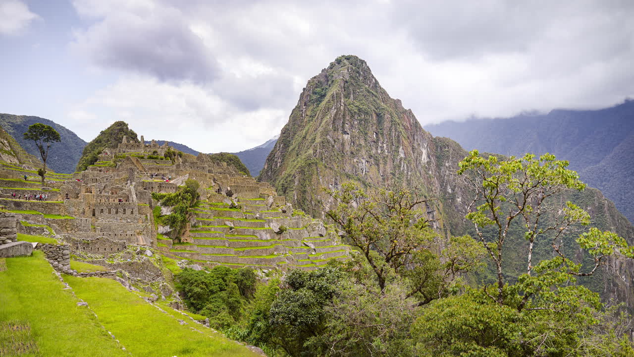 Machu Picchu landscape timelapse of the famous ancient Inca ruins in Peru. Time lapse of clouds over the Incan city with mountains and trees and scenery