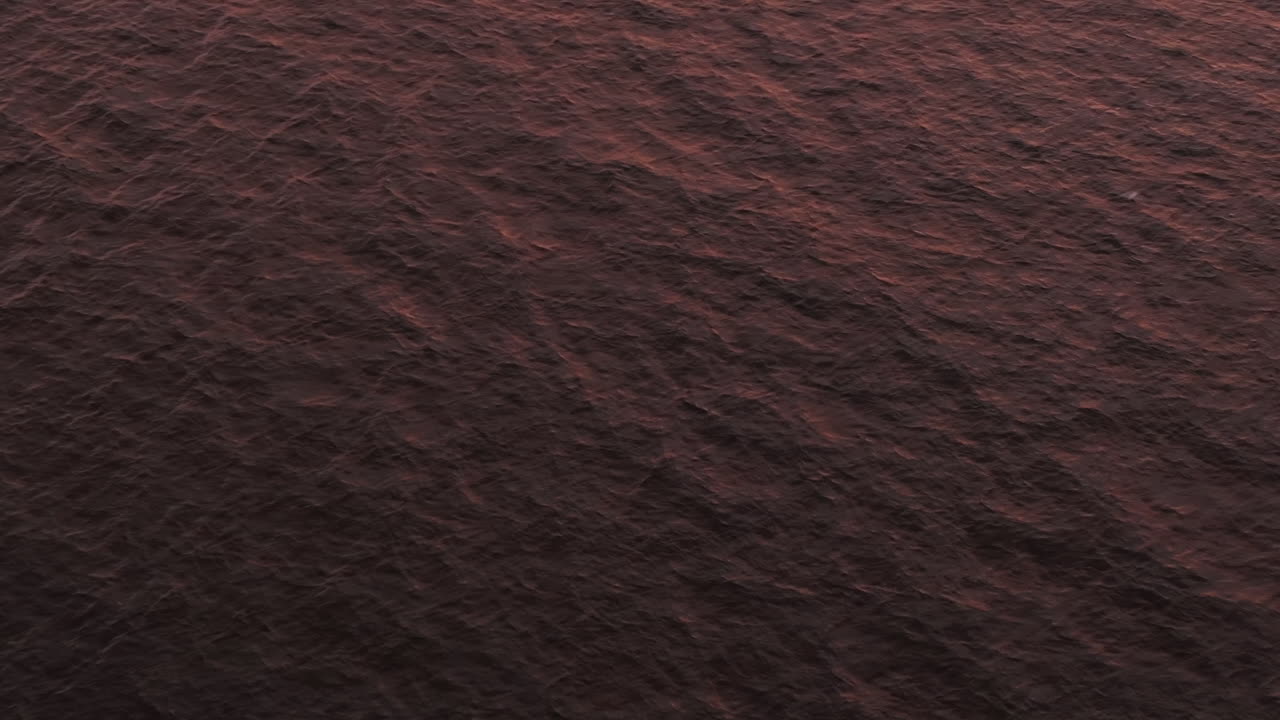 Aerial view of water in the ocean. Shot at dusk