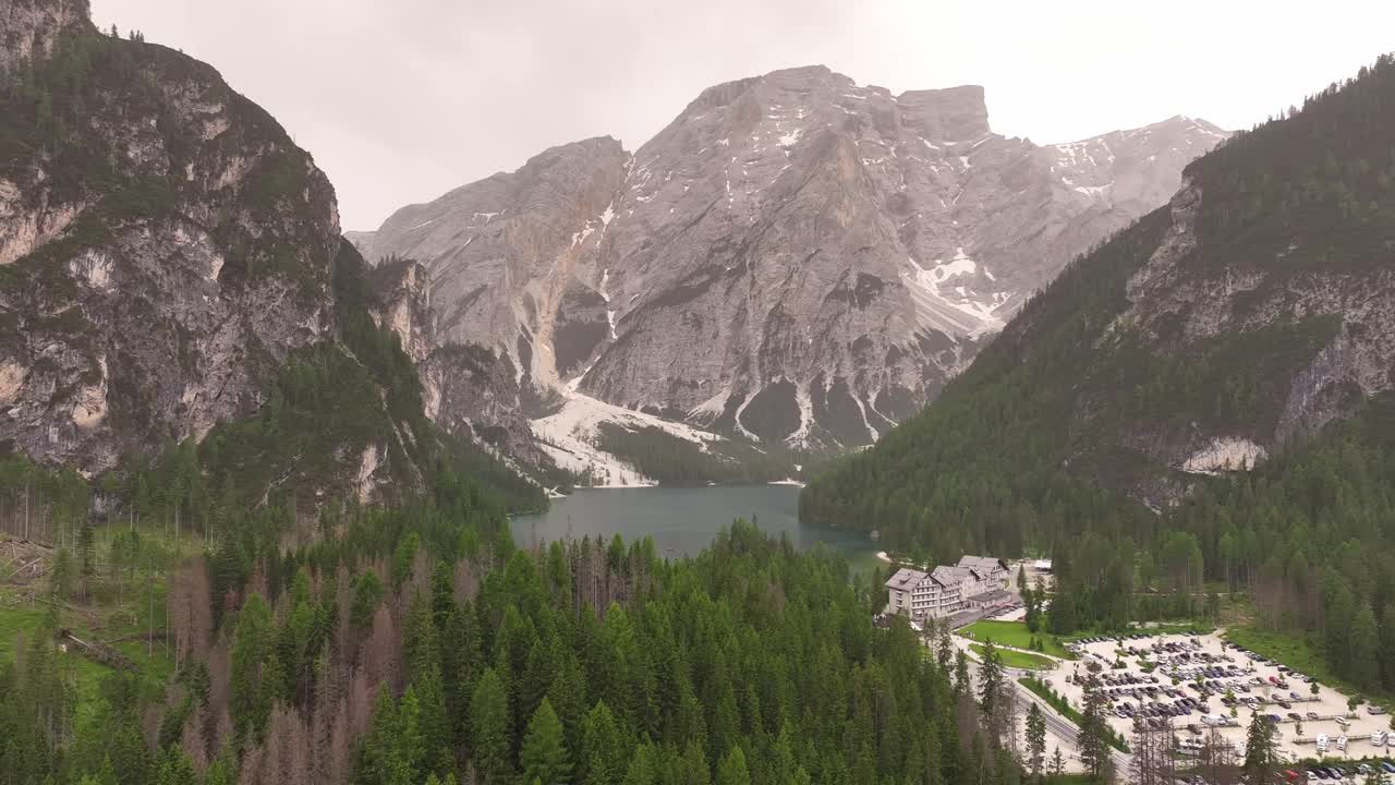 Mountains round Lake Braies stand, guardians bold of this cherished land