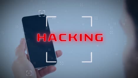 animation of scope scanning over hacking text banner over rear view of a man using smartphone