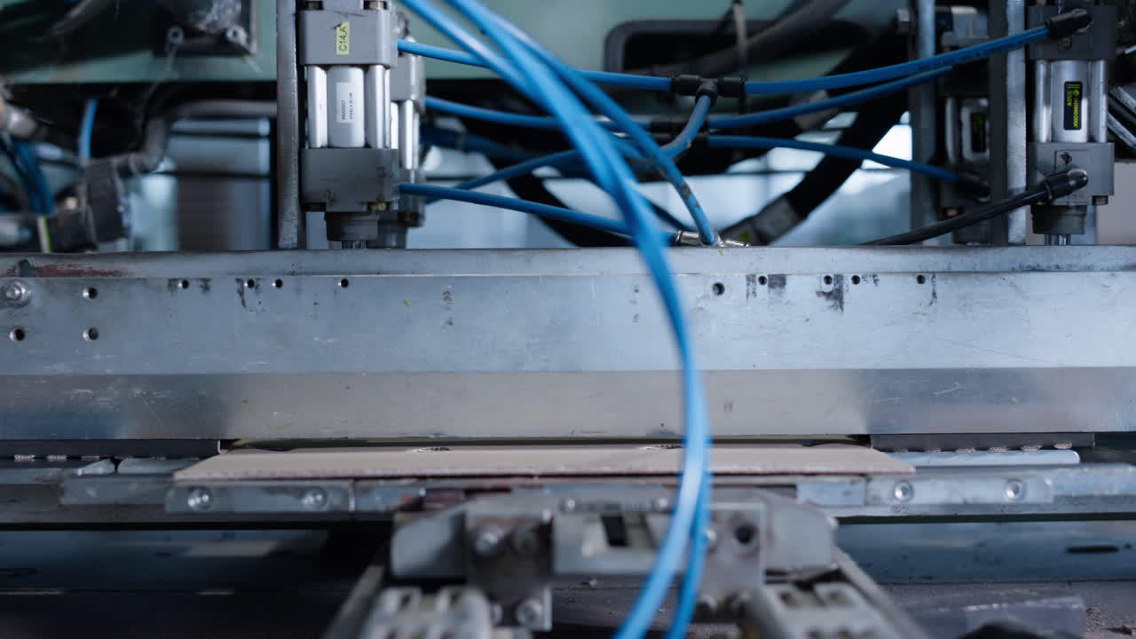 Manufacture factory cardbox production process at technological facility closeup