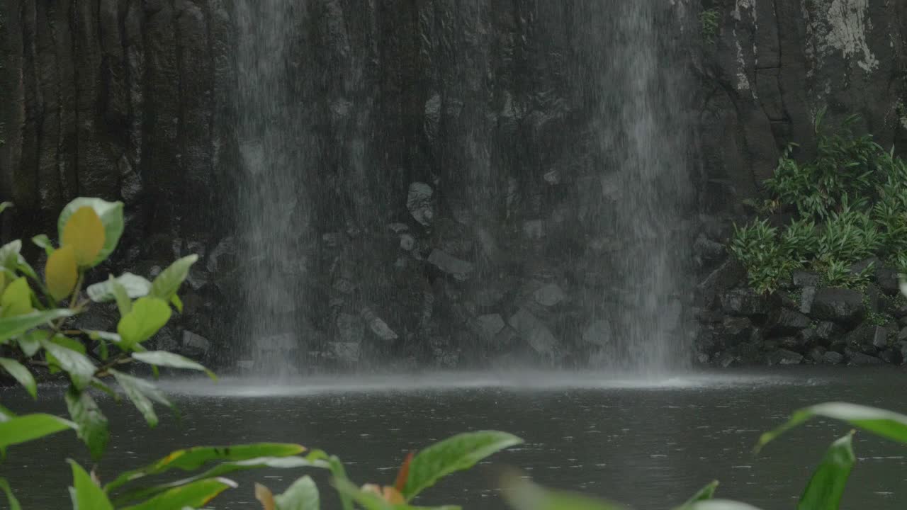 Water Cascading Down At Millaa Millaa Falls In Queensland, Australia - wide shot