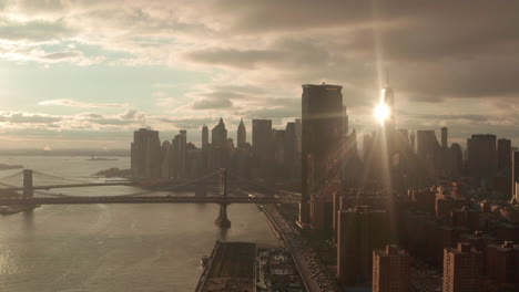 rising aerial shot of nyc financial district from east river