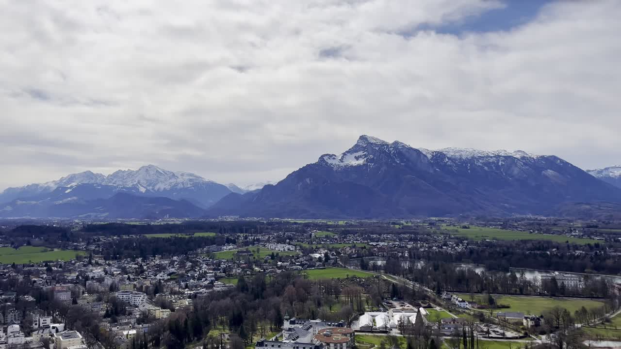 Panoramic view over Salzburg from Festung Hohensalzburg (Salzburg Castle) looking towards snow-topped mountains - Salzburg, Austria