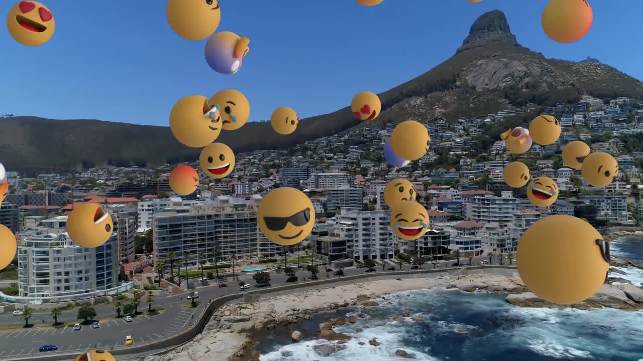composición digital de varios emojis de rostros flotando contra la vista aérea del paisaje urbano