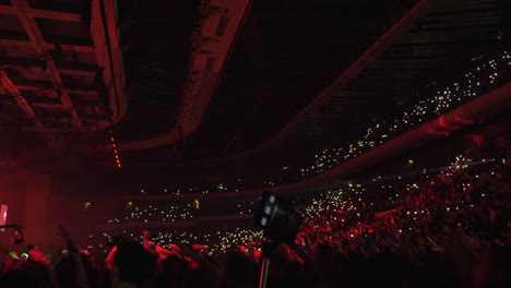 audience dancing with lights at the concert